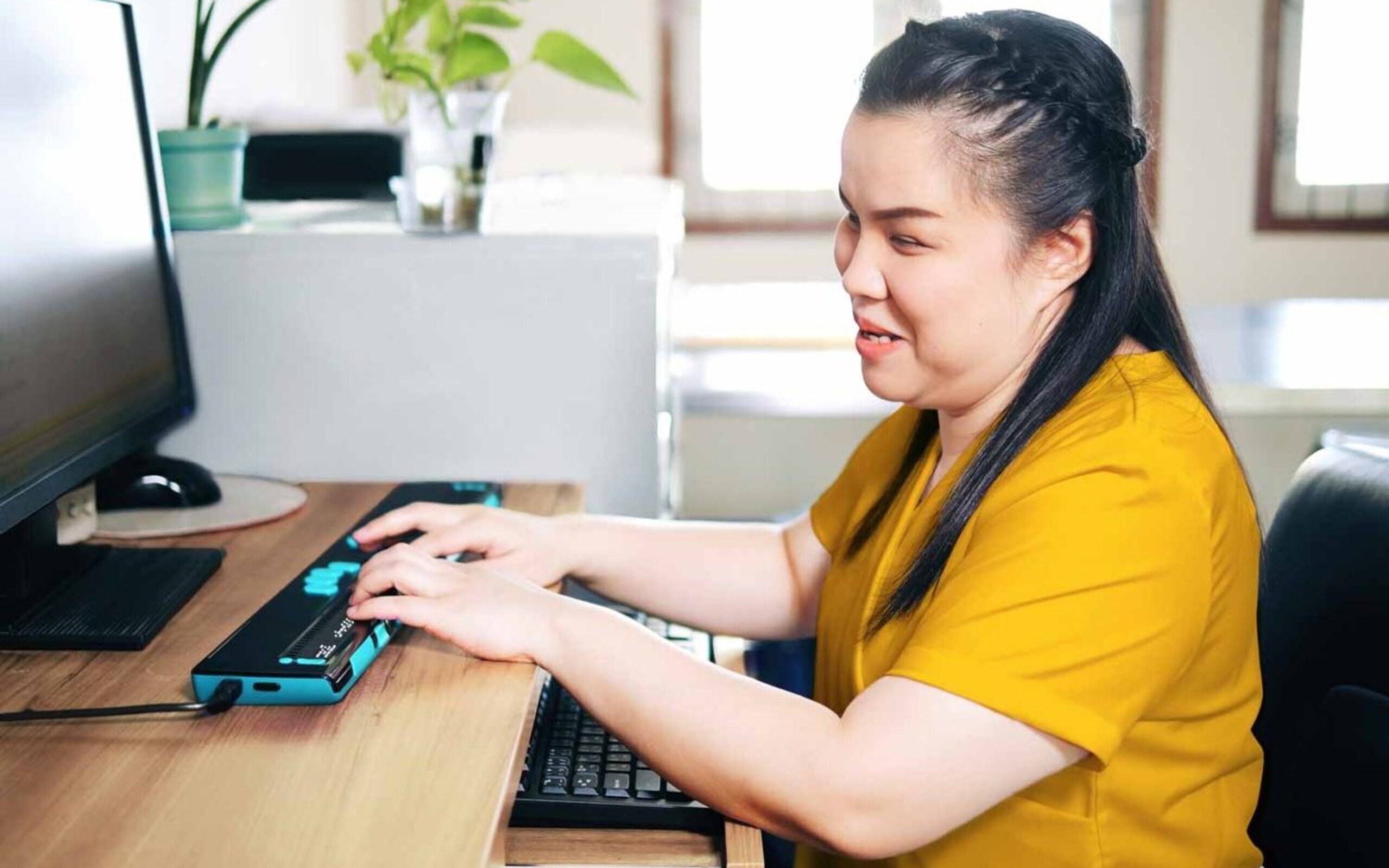 Person using keyboard navigation and assistive technology to browse the web